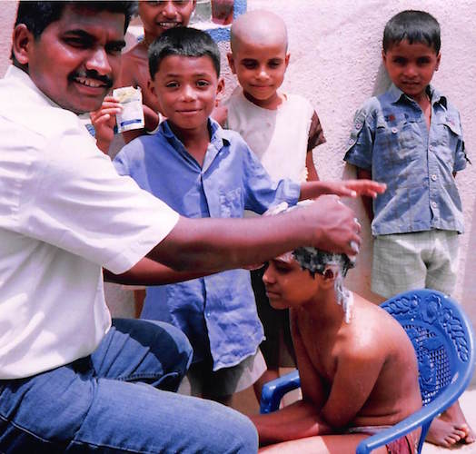 Washing the hair of a newly orphaned boy.